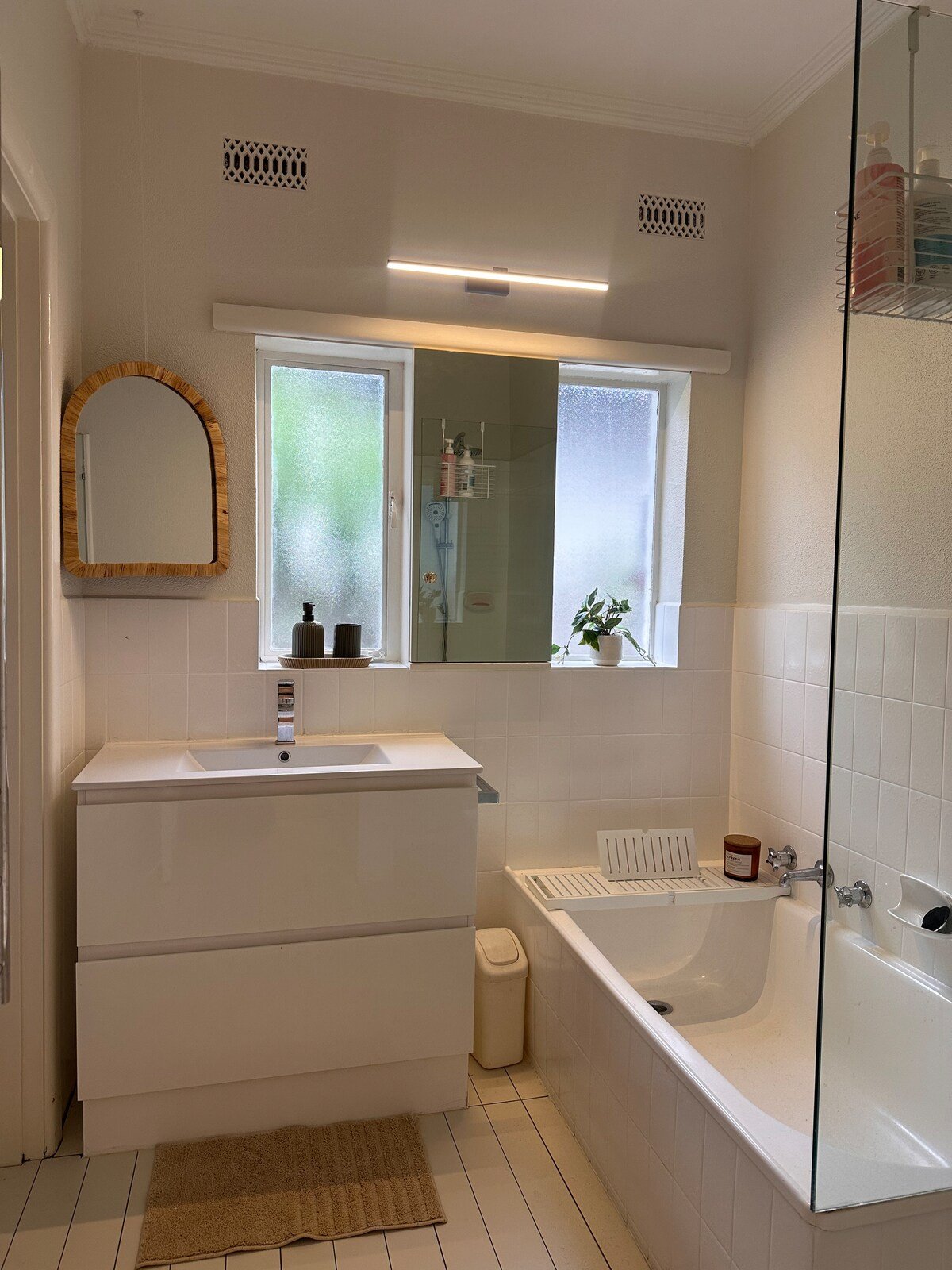 Bright bathroom with bathtub and shower